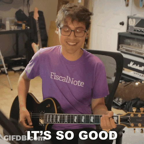 Man In Purple Shirt Playing Guitar GIF