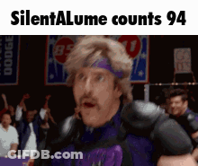 A Man Wearing A Purple Headband Is Standing In Front Of A Crowd With The Words Silentalume Counts 94 On The Bottom GIF