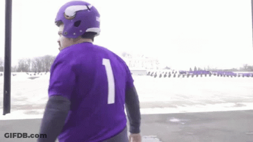 A Man Wearing A Purple Jersey With The Number One On It GIF