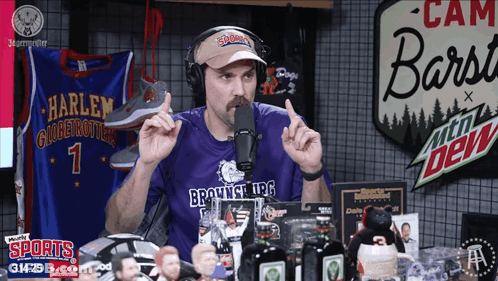 A Man Wearing A Purple Shirt That Says Brownsville Ufc Talks Into A Microphone GIF