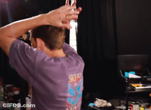 A Man Wearing A Purple Shirt That Says Sky On The Back Of It GIF