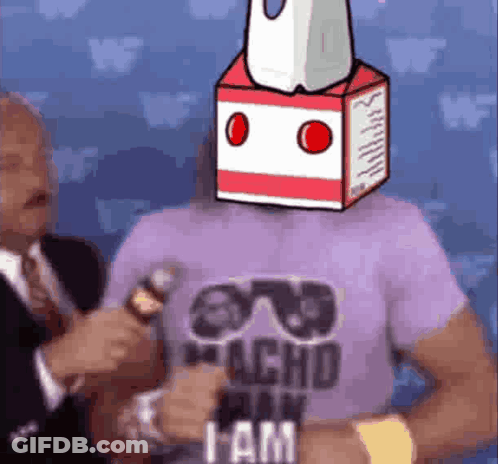 A Man Wearing A Purple Shirt With A Milk Carton On His Head Is Talking Into A Microphone . GIF