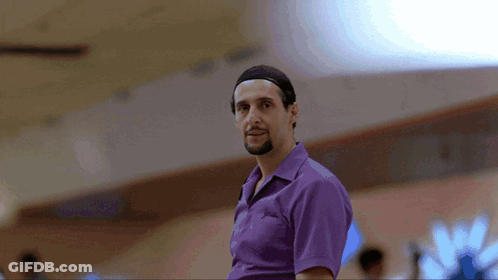 A Man Wearing A Purple Shirt With The Word Columbia On It GIF