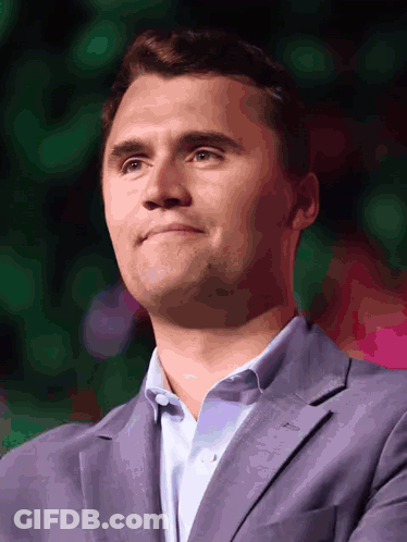 A Man Wearing A Purple Suit And A White Shirt GIF