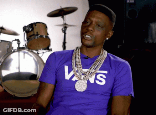 A Man Wearing A Purple Vans T-Shirt Is Sitting In Front Of Drums GIF