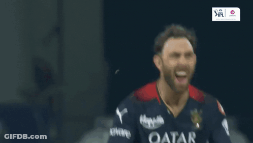 A Man Wearing A Qatar Airways Shirt Is Laughing GIF