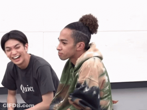 A Man Wearing A Quiet T-Shirt Is Laughing Next To Another Man GIF
