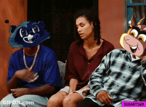 A Man Wearing A Raccoon Mask Sits Next To A Woman And Another Man GIF