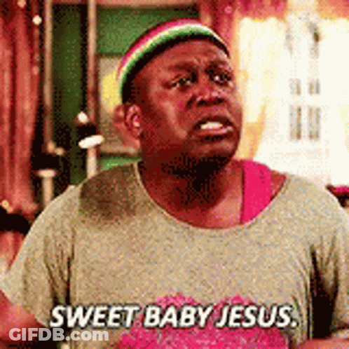 A Man Wearing A Rasta Hat And A T-Shirt That Says `` Sweet Baby Jesus '' Is Crying . GIF