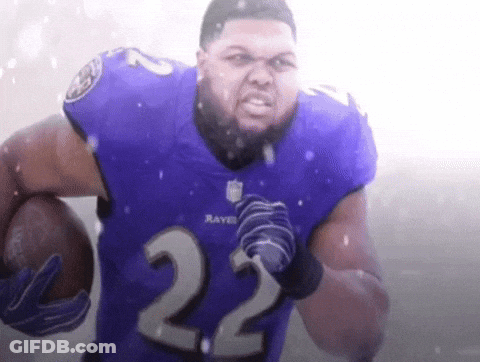 A Man Wearing A Ravens Jersey With The Number 22 On It GIF