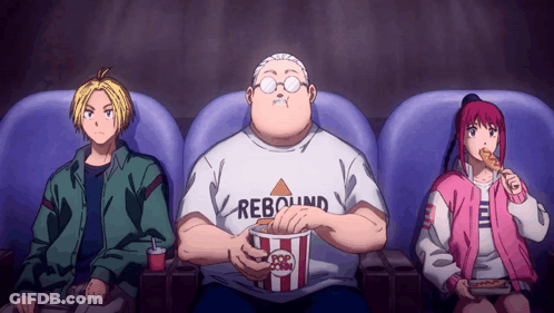 A Man Wearing A Rebound Shirt Eating Popcorn GIF