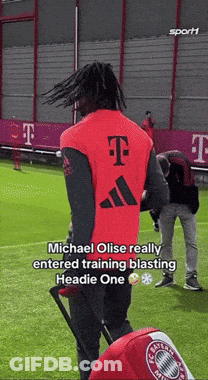 A Man Wearing A Red Adidas Vest With A T On The Back GIF