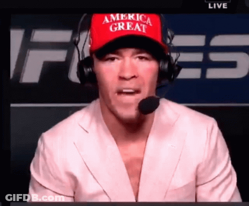 A Man Wearing A Red America Great Hat And Headphones GIF