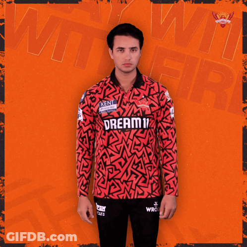 A Man Wearing A Red And Black Jersey That Says Dream On It GIF
