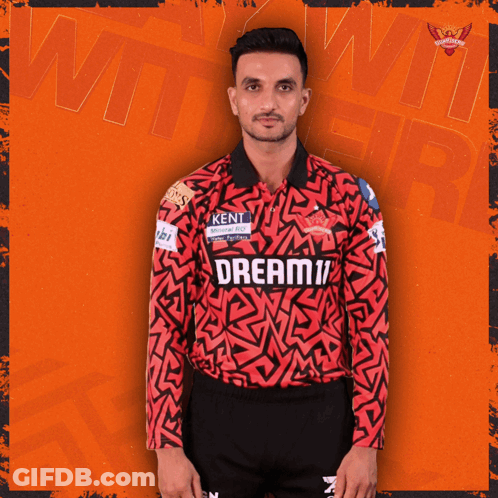 A Man Wearing A Red And Black Jersey That Says Dream11 On It GIF