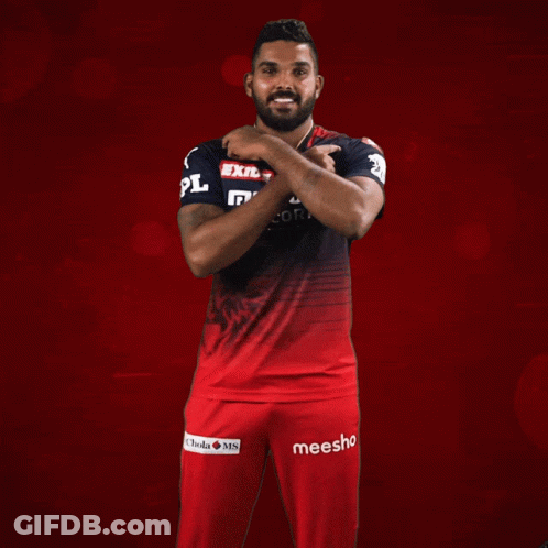 A Man Wearing A Red And Black Shirt That Says Exide Muthoot Fincorp On It GIF