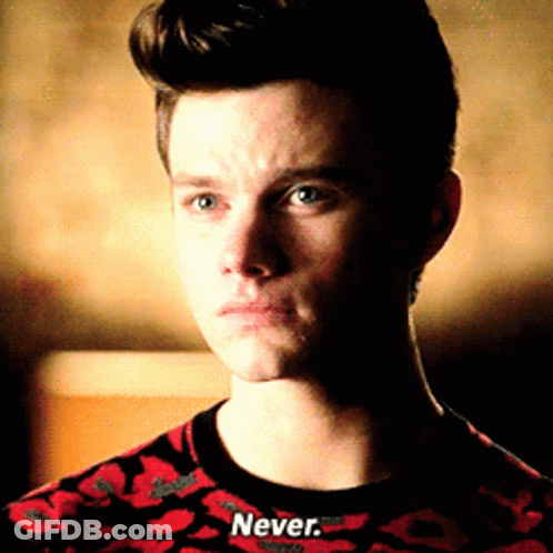 A Man Wearing A Red And Black Shirt That Says Never GIF