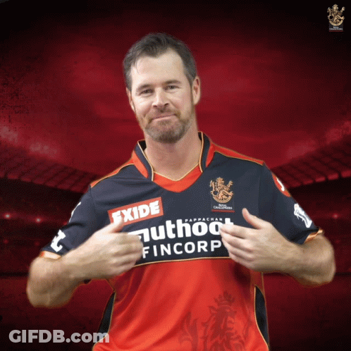 A Man Wearing A Red And Blue Shirt That Says Exide GIF