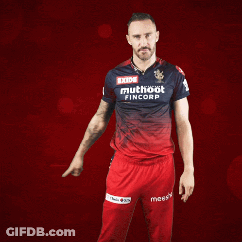 A Man Wearing A Red And Blue Shirt That Says Exide Muthoot Fincorp GIF