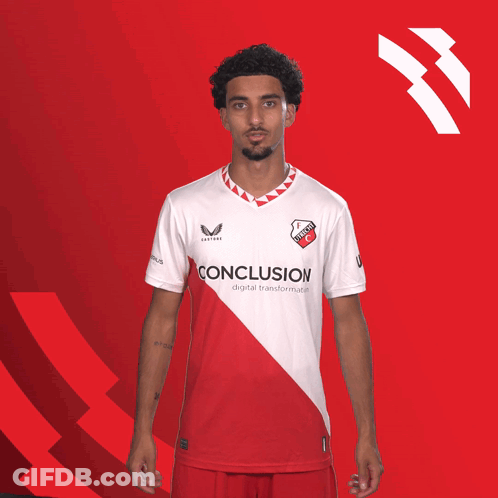 A Man Wearing A Red And White Conclusion Shirt GIF