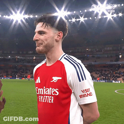 A Man Wearing A Red And White Emirates Fly Better Shirt GIF