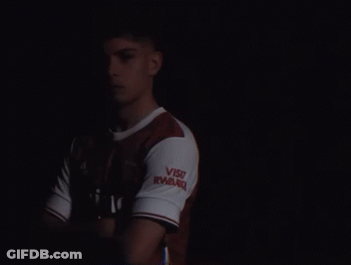 A Man Wearing A Red And White Emirates Shirt GIF