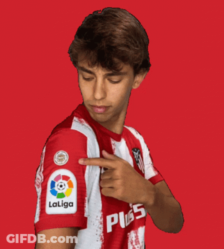A Man Wearing A Red And White Laliga Shirt Points To His Sleeve GIF