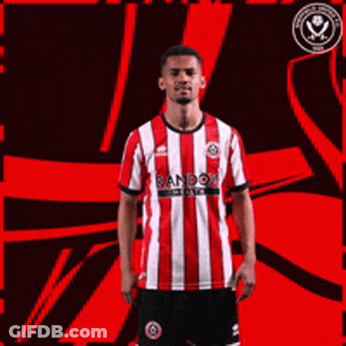 A Man Wearing A Red And White Striped Shirt With Random Written On It Giving A Thumbs Up GIF