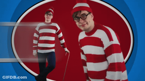 A Man Wearing A Red And White Striped Sweater And Hat GIF