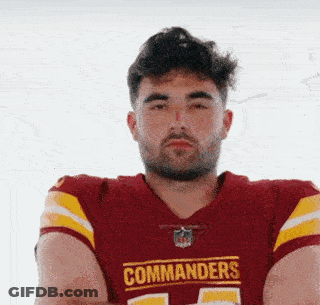 A Man Wearing A Red And Yellow Commanders Jersey GIF