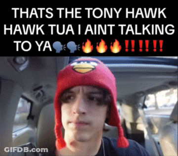 A Man Wearing A Red Angry Bird Hat Is In A Car GIF