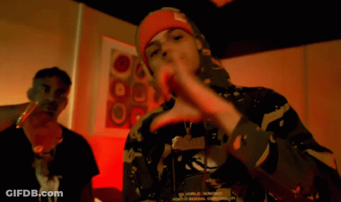 A Man Wearing A Red Bandana On His Head Making A Face GIF