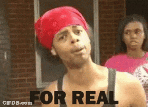 A Man Wearing A Red Bandana Says " For Real " In Front Of A Brick Building GIF