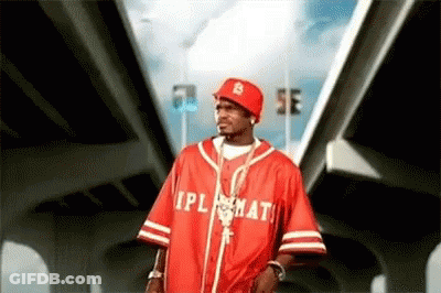 A Man Wearing A Red Baseball Jersey With The Word Ipl On It . GIF