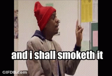 A Man Wearing A Red Beanie And A Suit Says " And I Shall Smoketh It " GIF