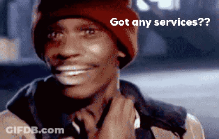 A Man Wearing A Red Beanie Is Smiling And Says Got Any Services GIF