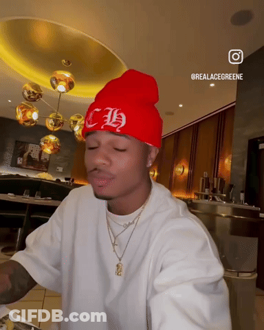 A Man Wearing A Red Beanie With The Letter Ch On It GIF