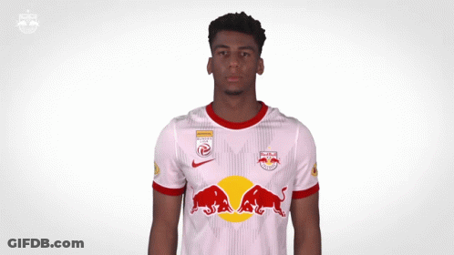 A Man Wearing A Red Bull Shirt Is Screaming GIF