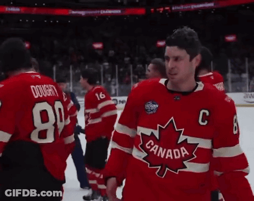 A Man Wearing A Red Canada Jersey Stands On The Ice GIF