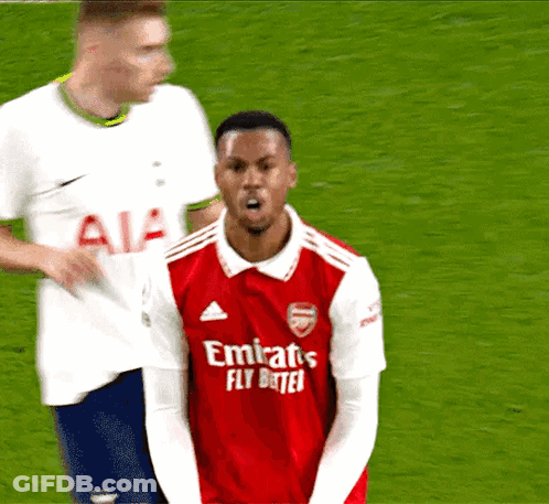 A Man Wearing A Red Emirates Fly Better Jersey GIF