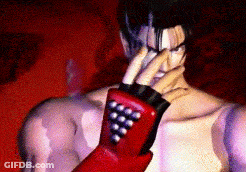 A Man Wearing A Red Glove With A Bunch Of Balls On It GIF