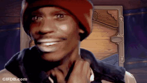 A Man Wearing A Red Hat And A Black Vest Is Smiling GIF