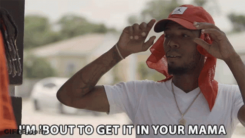 A Man Wearing A Red Hat And A Red Bandana Says " I 'M Bout To Get It In Your Mama " GIF