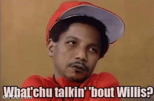 A Man Wearing A Red Hat And A Red Shirt Is Talking To Someone While Smoking A Cigarette . GIF