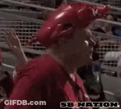 A Man Wearing A Red Hat And A Red Shirt With Woo Pig Written On It GIF