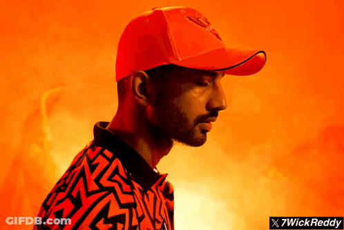 A Man Wearing A Red Hat And A Shirt That Says 7Wickreddy On It GIF