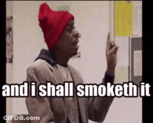 A Man Wearing A Red Hat And A Suit Says And I Shall Smoke It GIF