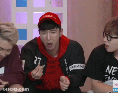 A Man Wearing A Red Hat Has The Number 27 On His Sweatshirt GIF