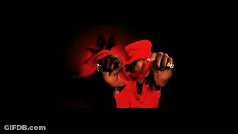 A Man Wearing A Red Hat Is Dancing With Another Man GIF