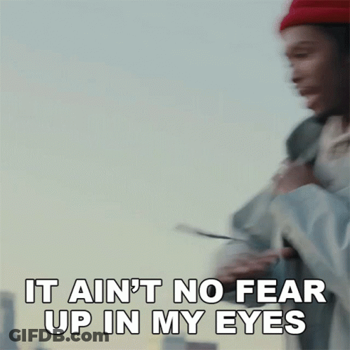 A Man Wearing A Red Hat Is Saying It Ain 'T No Fear Up In My Eyes GIF